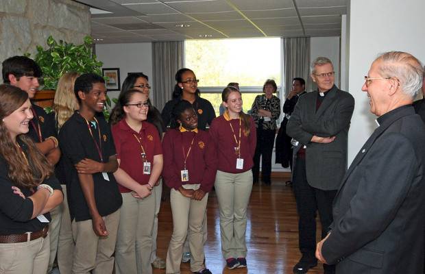 Fr Adolfo Nicolás SJ, 30th Superior General of the Society of Jesus (the Jesuits), with student from Loyola Academy